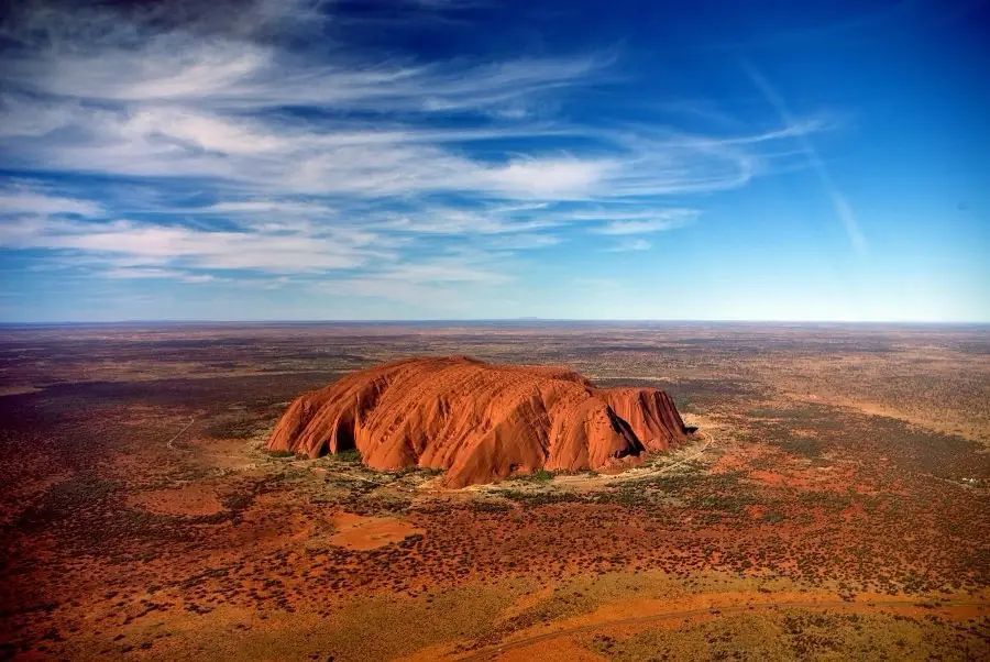Uluru and the surrounding desert seen from the air